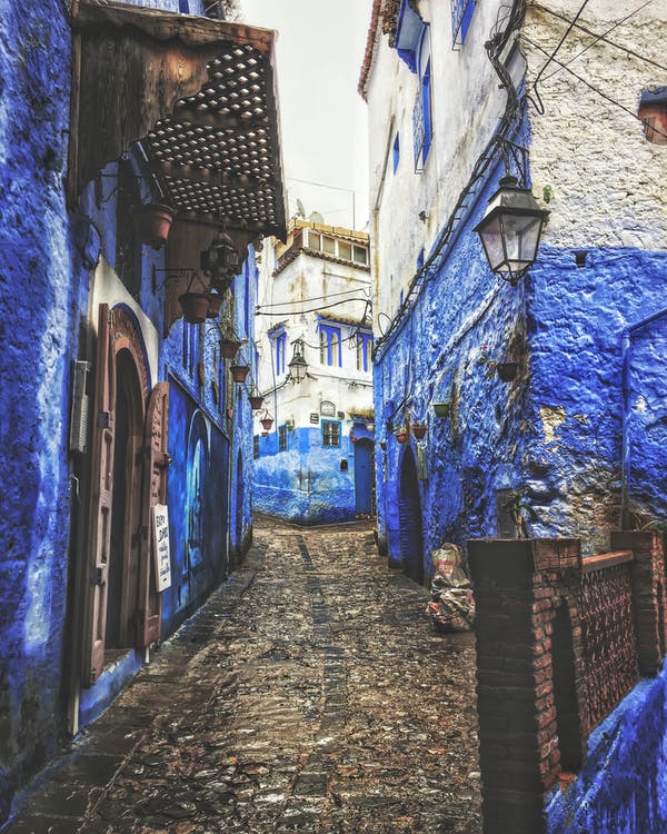 Blue paint on old white buildings